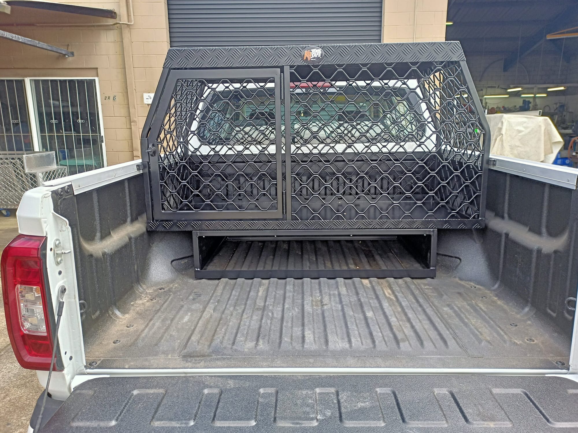 Rear view of bulldog ute cage showing the under cage storage.